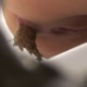 A hidden camera type video featuring women, as seen through a hole in the bathroom wall, pooping into a toilet in 3 scenes.
